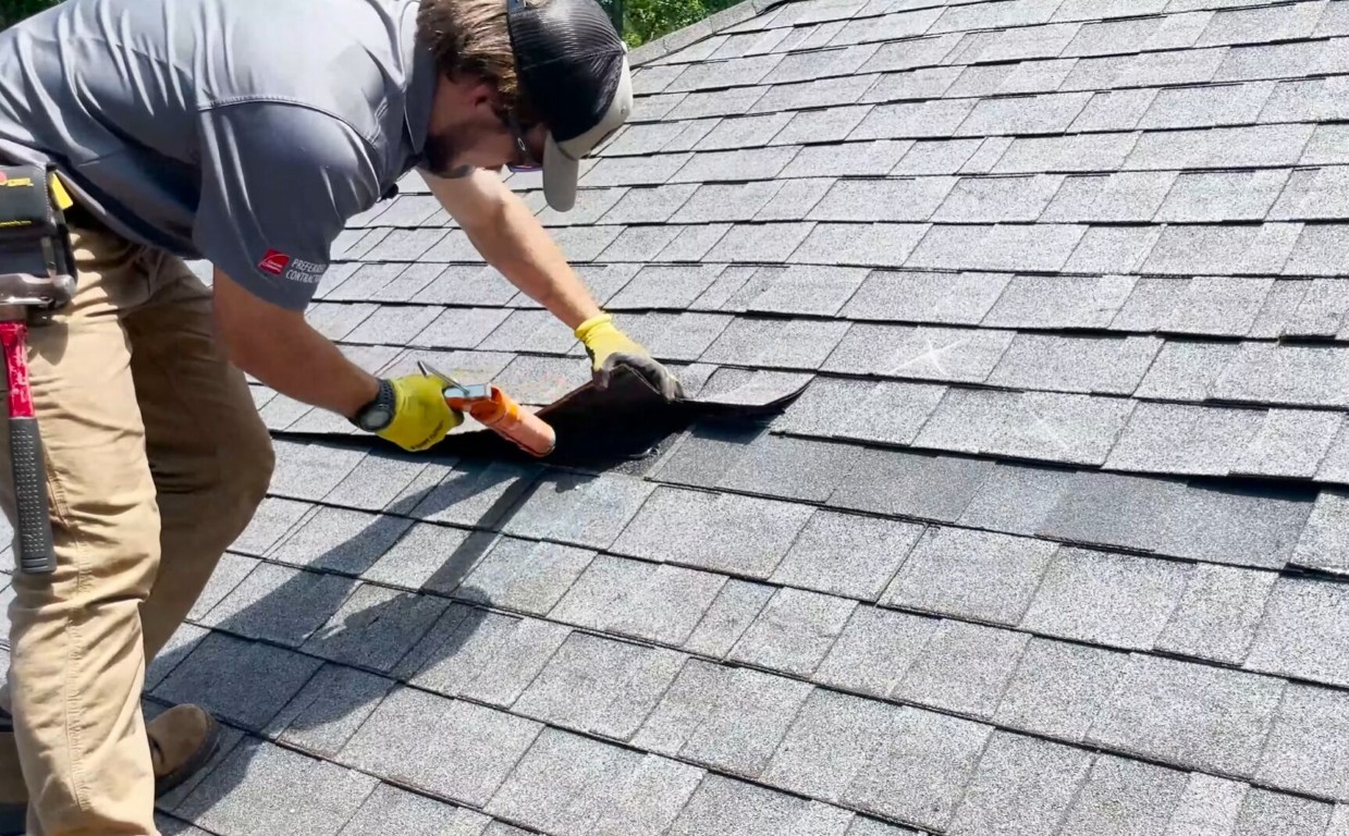 Expert roof repair technician fixing damaged shingles in Sahuarita, AZ